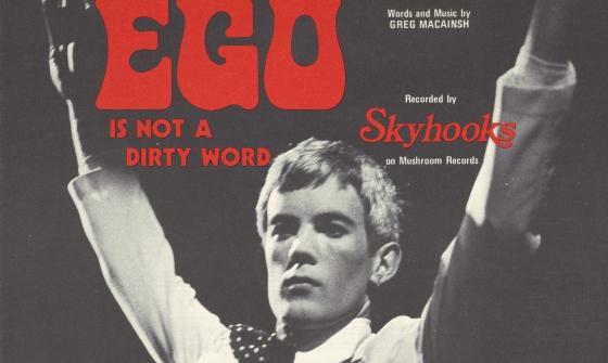 Black and white images of members of the band Skyhooks with red text reading 'Ego is not a dirty word'