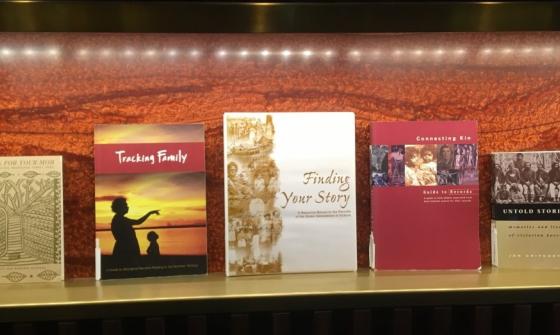 5 First Nations Family History Books on a light shelf on display