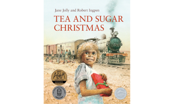 Cover for children's book 'Tea and Sugar Chrismas' featuring an illustration of a young child holding a wrapped christmas present standing and smiling in front of a train