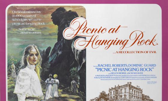 To the left of the image the illustrated film poster shows girls in flowing white dresses in front of a large rock formation. The right side of the image features the film title and credits and a drawing of a large house.