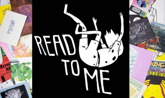 The Read to Me logo with white text on a black background is pictured atop a pile of zines and comic books scattered across a table