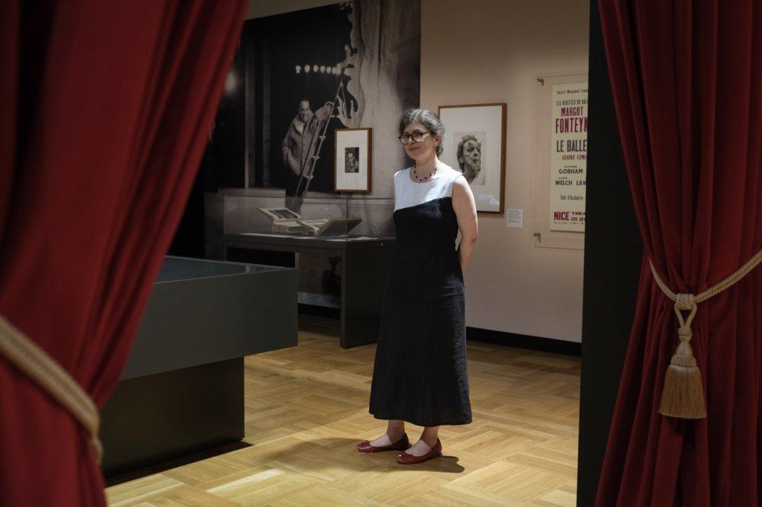 Dr Susannah Helman stands in the On Stage exhibition gallery.