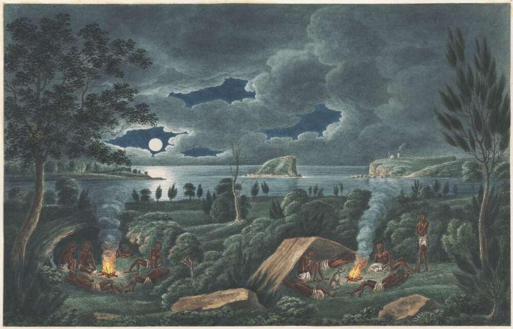 A landscape showing a group of people gathered around two campfires. Some sit and lie near the fires, while others stand. Smoke rises from the fires into the night sky. A body of water and distant cliffs are visible under a moonlit, partly cloudy sky.
