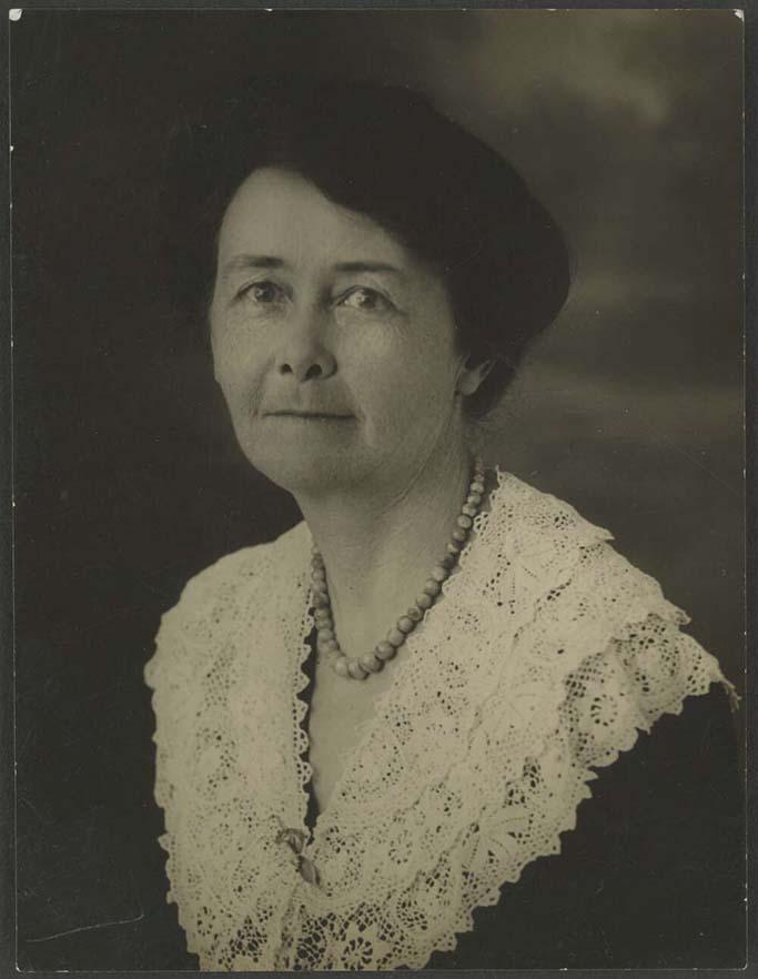 black and white photo of a woman looking at the camera