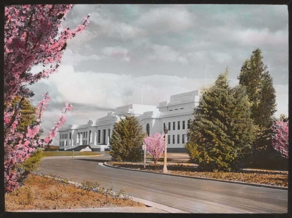 Photo of Old Parliament House, Canberra, with pink blossoms on surrounding trees