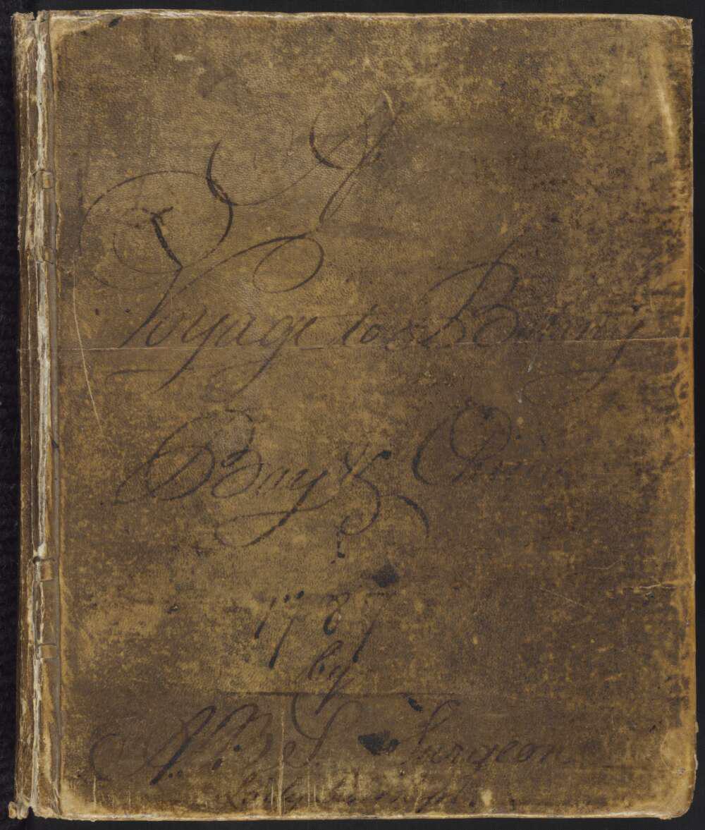 Aged book leather looking book cover with faded cursive writing