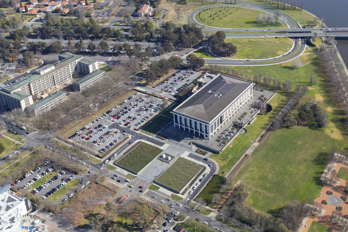 View of the Library building, carparks and nearby buildings and roads seen from a drone