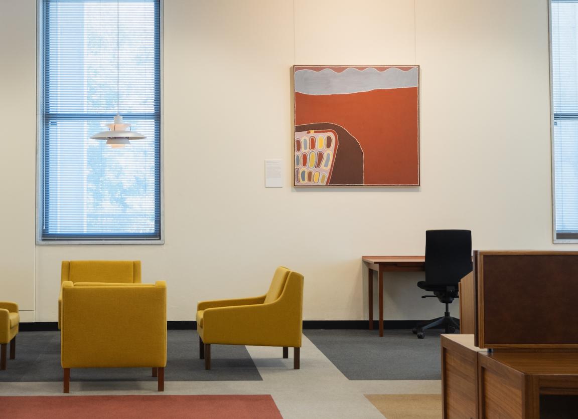 Orange, brown and white painting hung in the main reading room