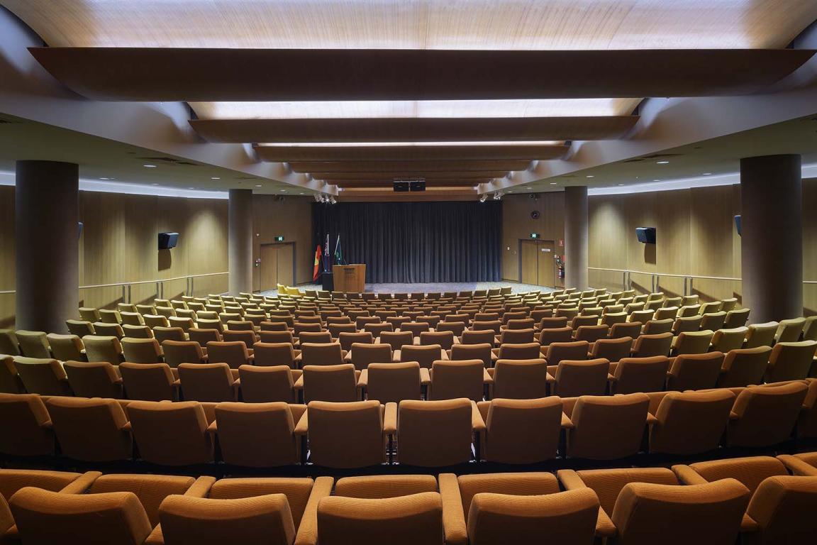 Looking from the back of an empty theatre towards the stage