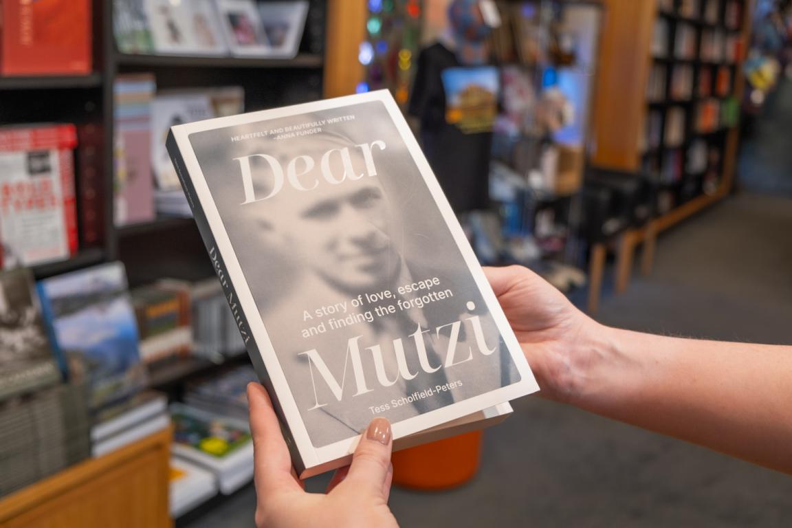 'Dear Mutzi' by Tess Scholfield-Peters being held up in the Bookshop