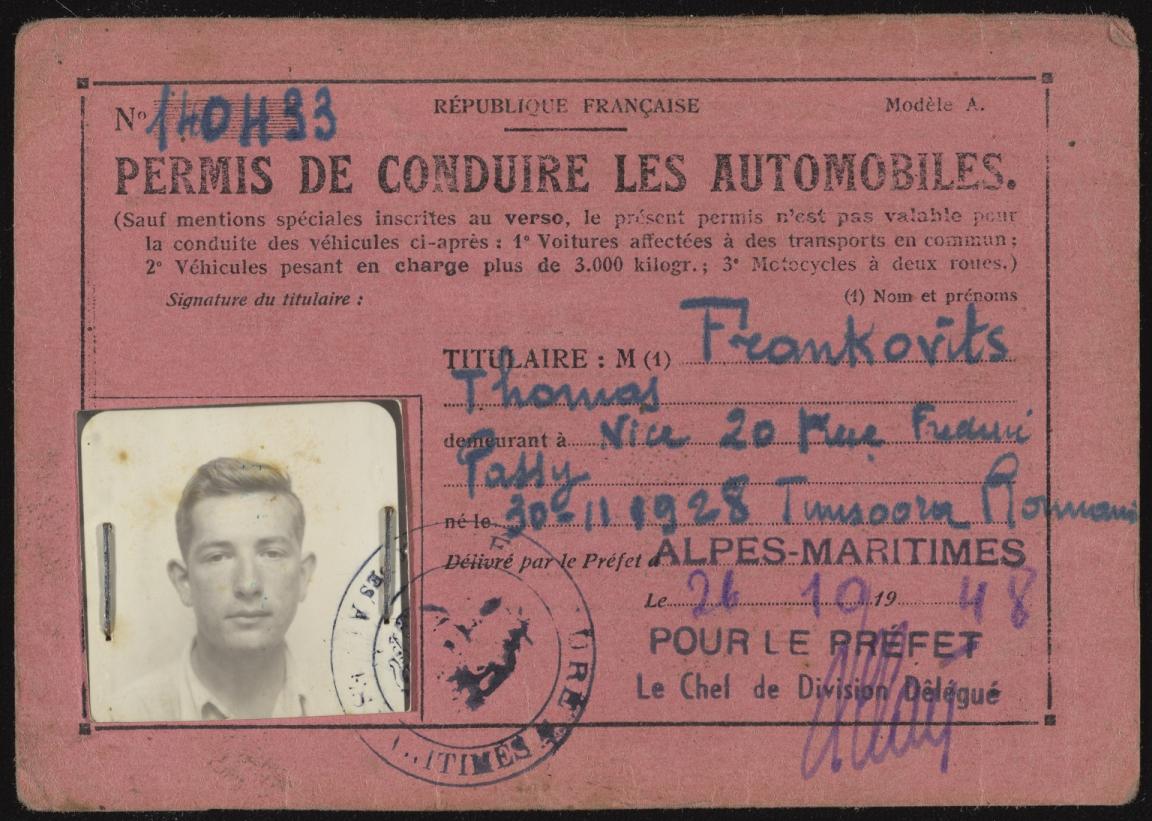 A pink French driver's license issued in 1948. It includes handwritten details and a black-and-white portrait of a man attached with metal clips. The text is in French, with stamps and signatures visible.