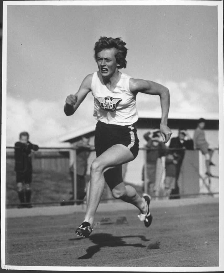black and white photo of a woman athlete running