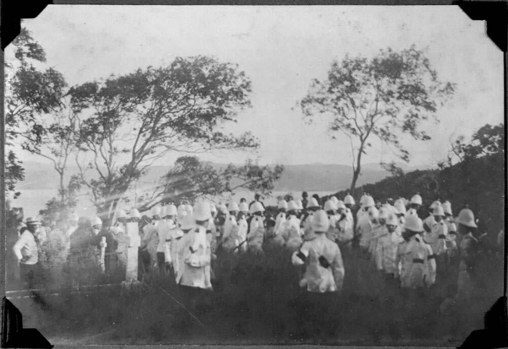 black and white photo of soldiers on an island