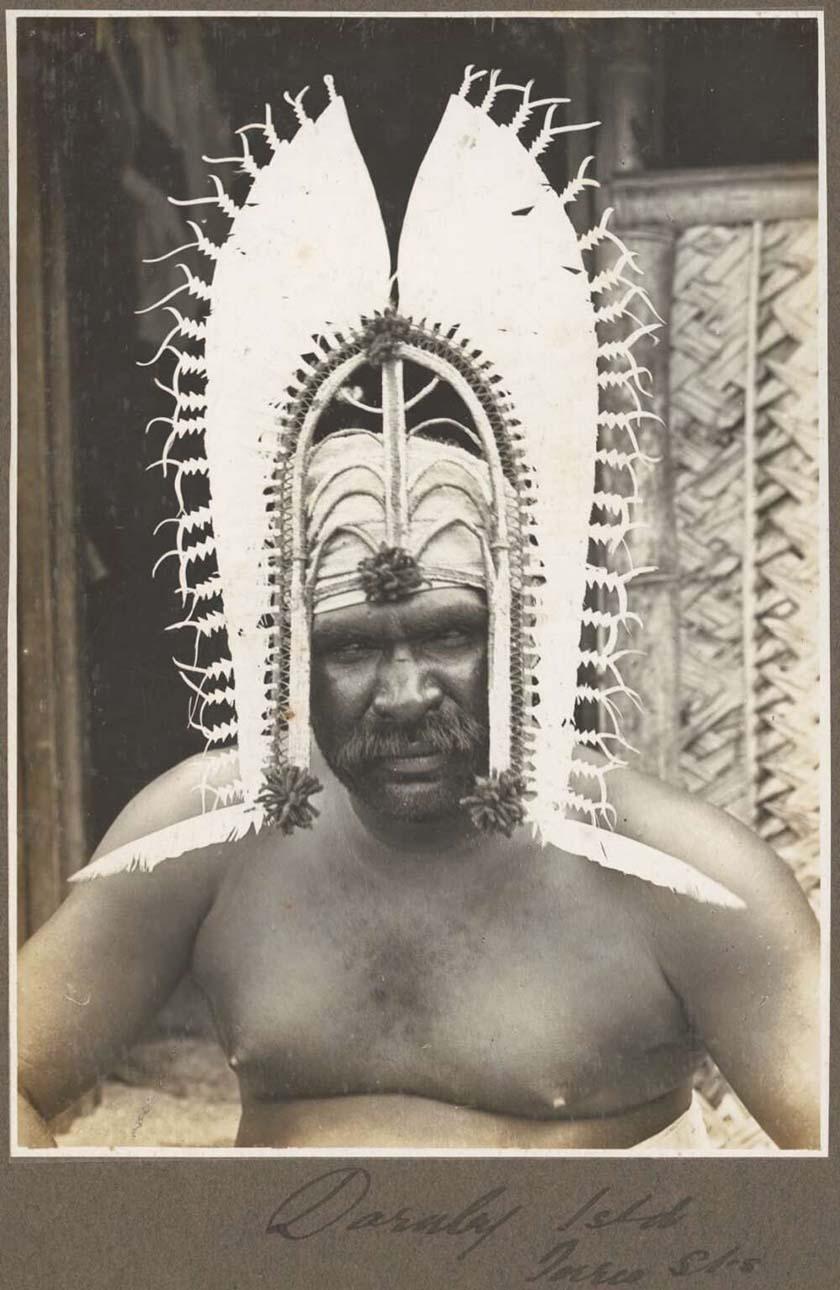 photo of a man wearing an islander head dress