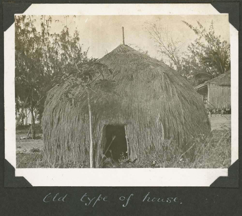 black and white photo of an island hut