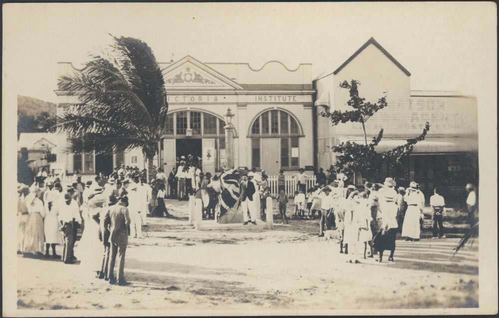 sepia photo of a monument being unveiled in a town street