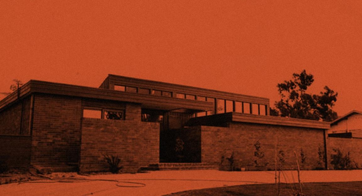 Orange and black stylised image of a house