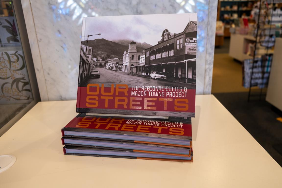 Book stack of 4 copies of 'Our Streets' books from NLA Publishing