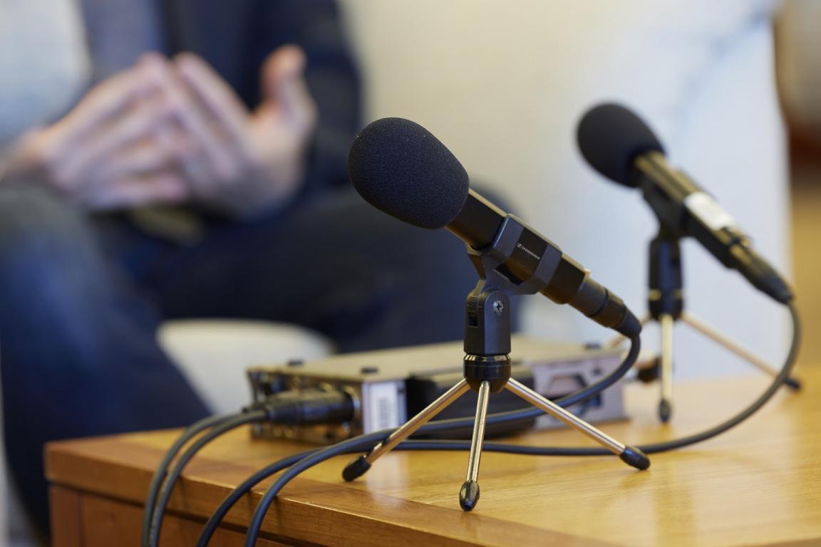 Two microphone on a table during an oral history interview
