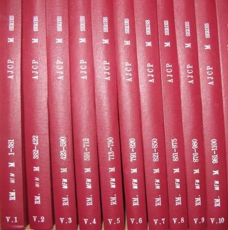 10 volumes of red bound books 
