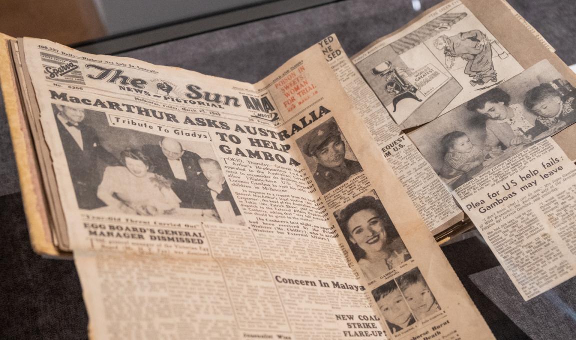 Scrapbook of newspaper clippings, including one full page and a cartoon, about the Gamboa family