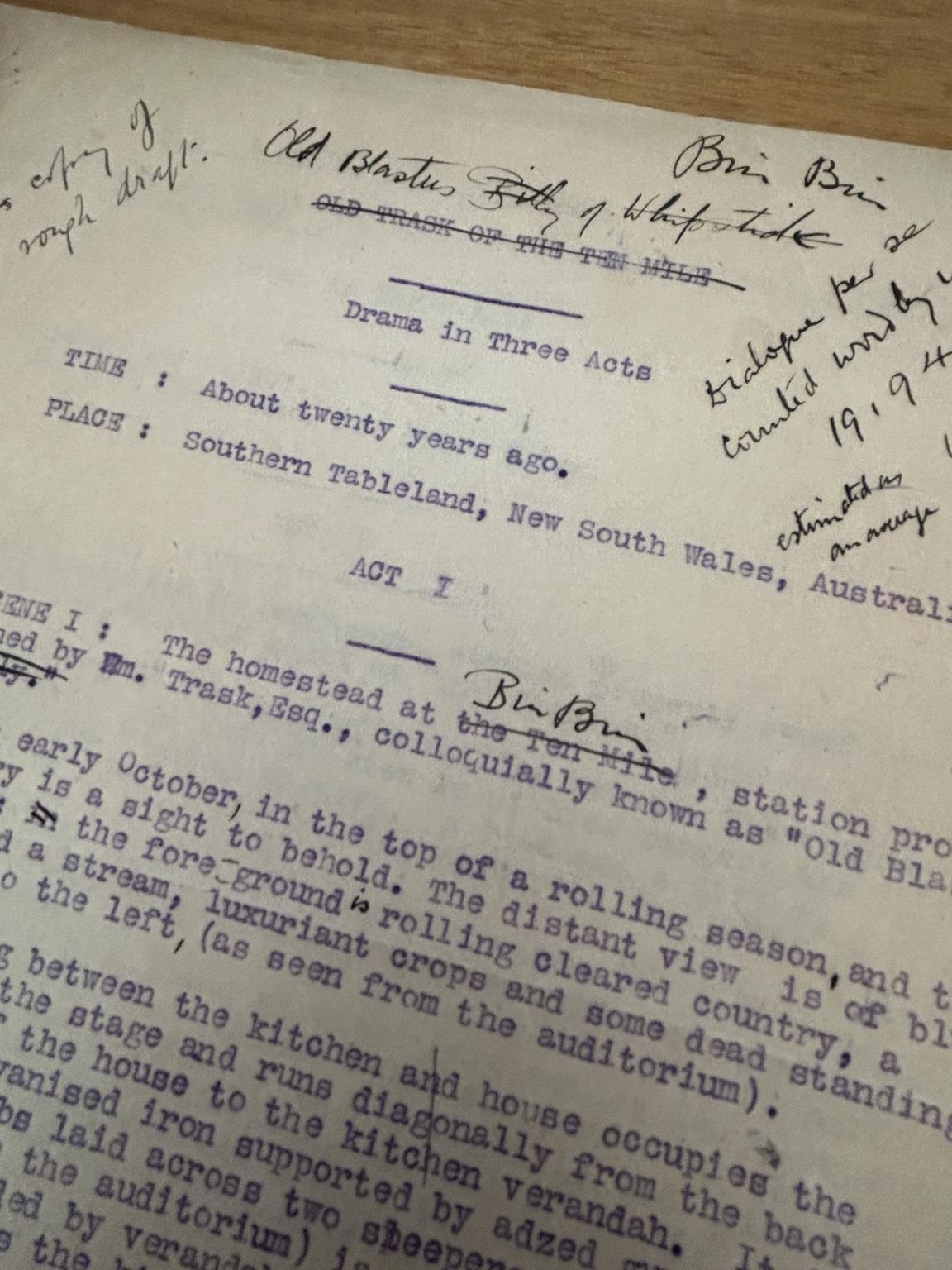 A typewritten manuscript in blue ink with hand written annotations in black ink