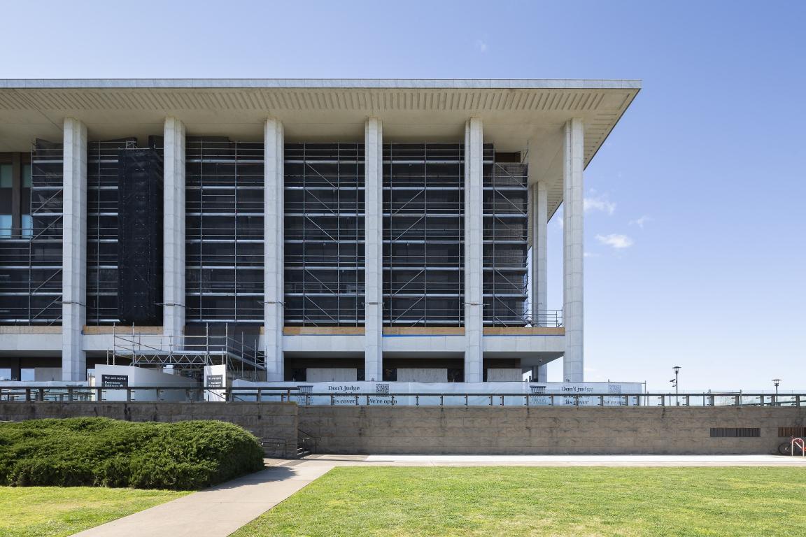 National Library building with scaffolding along the walls on a sunny day