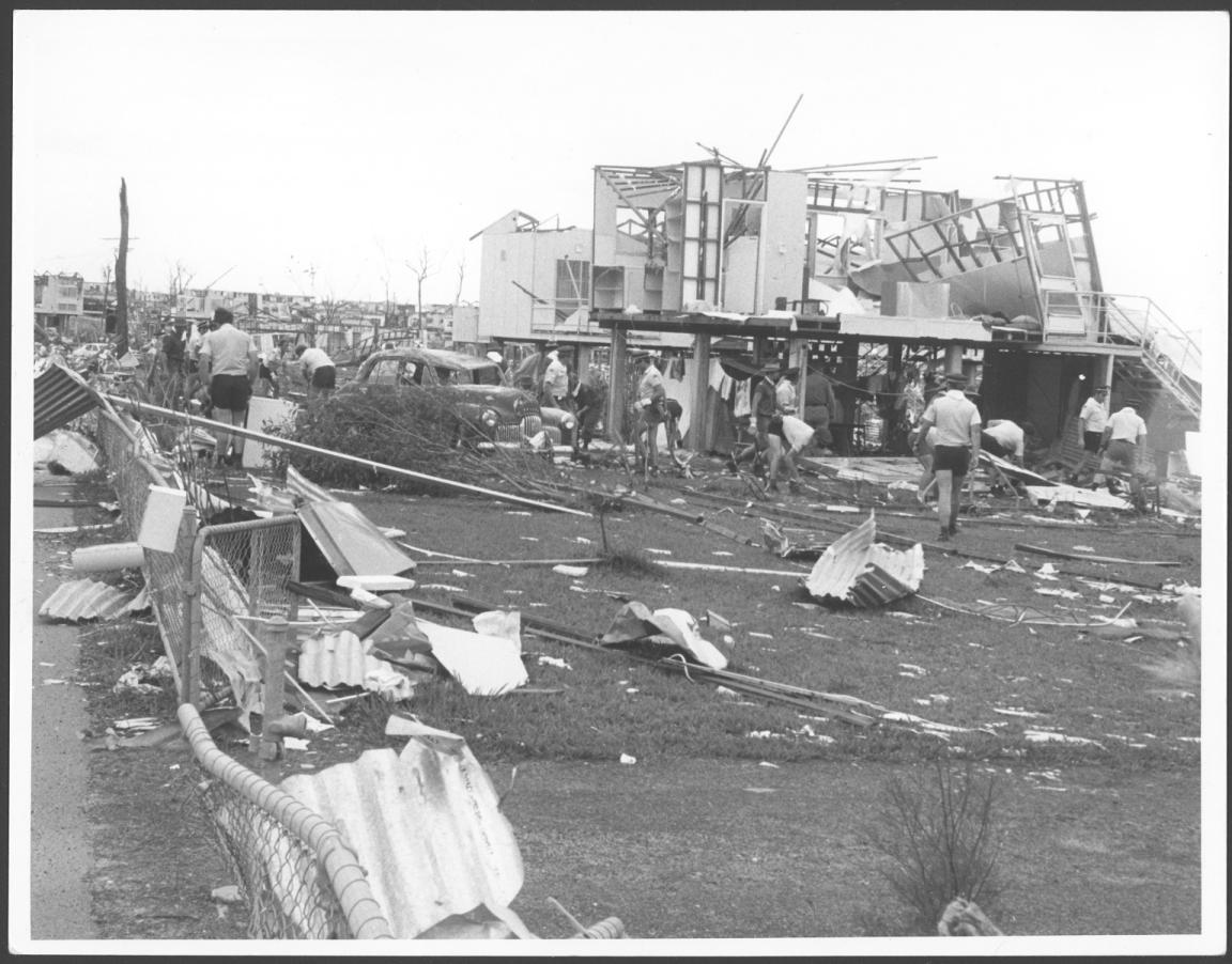 Black and white photo people responding to damage from Cyclone Tracy