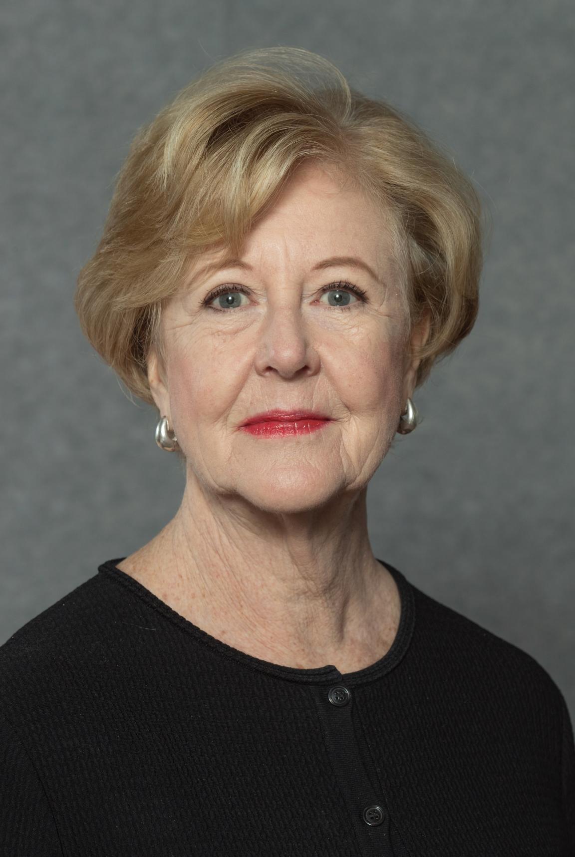 Photo portrait of Gillian Triggs with a small smile