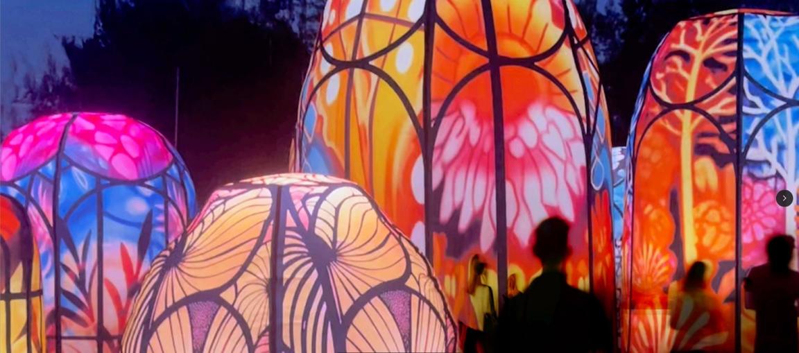 Large, colourful, immersive, inflatable artwork with people wandering through