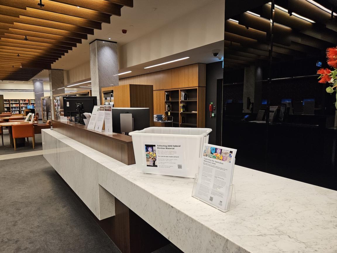 White plastic box on a counter in the National Library of Australia Reading Room. 