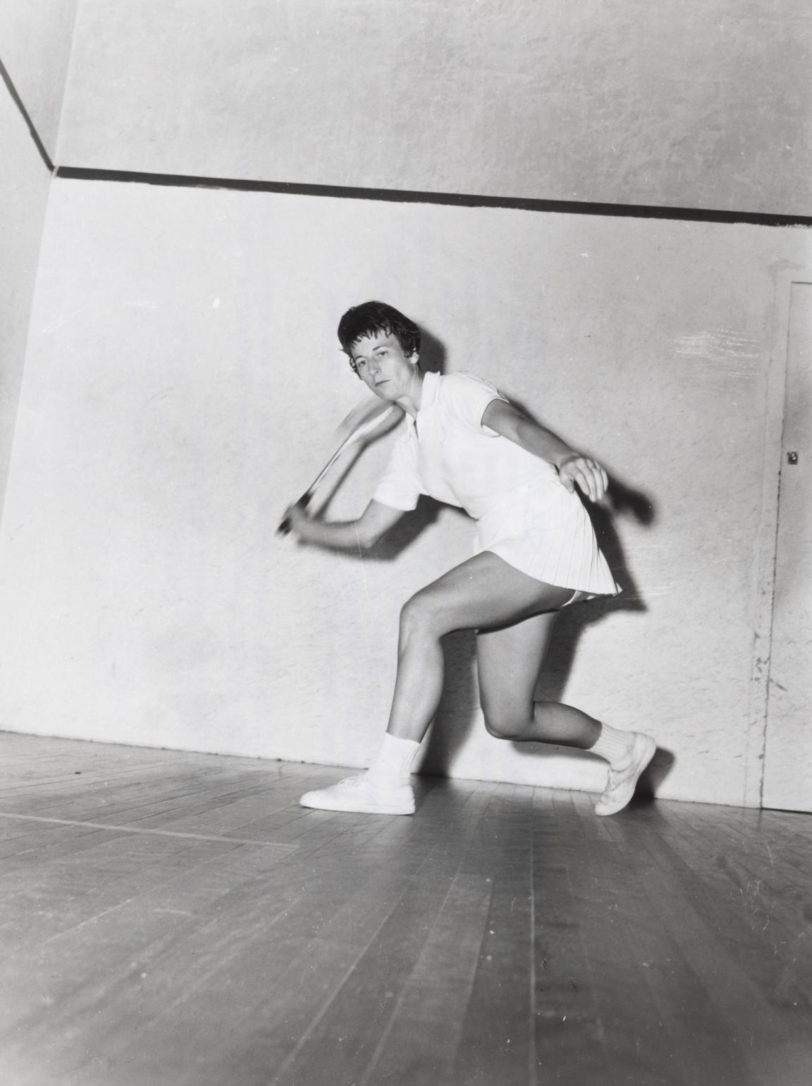 Black and white photo of Heather McKay playing squash