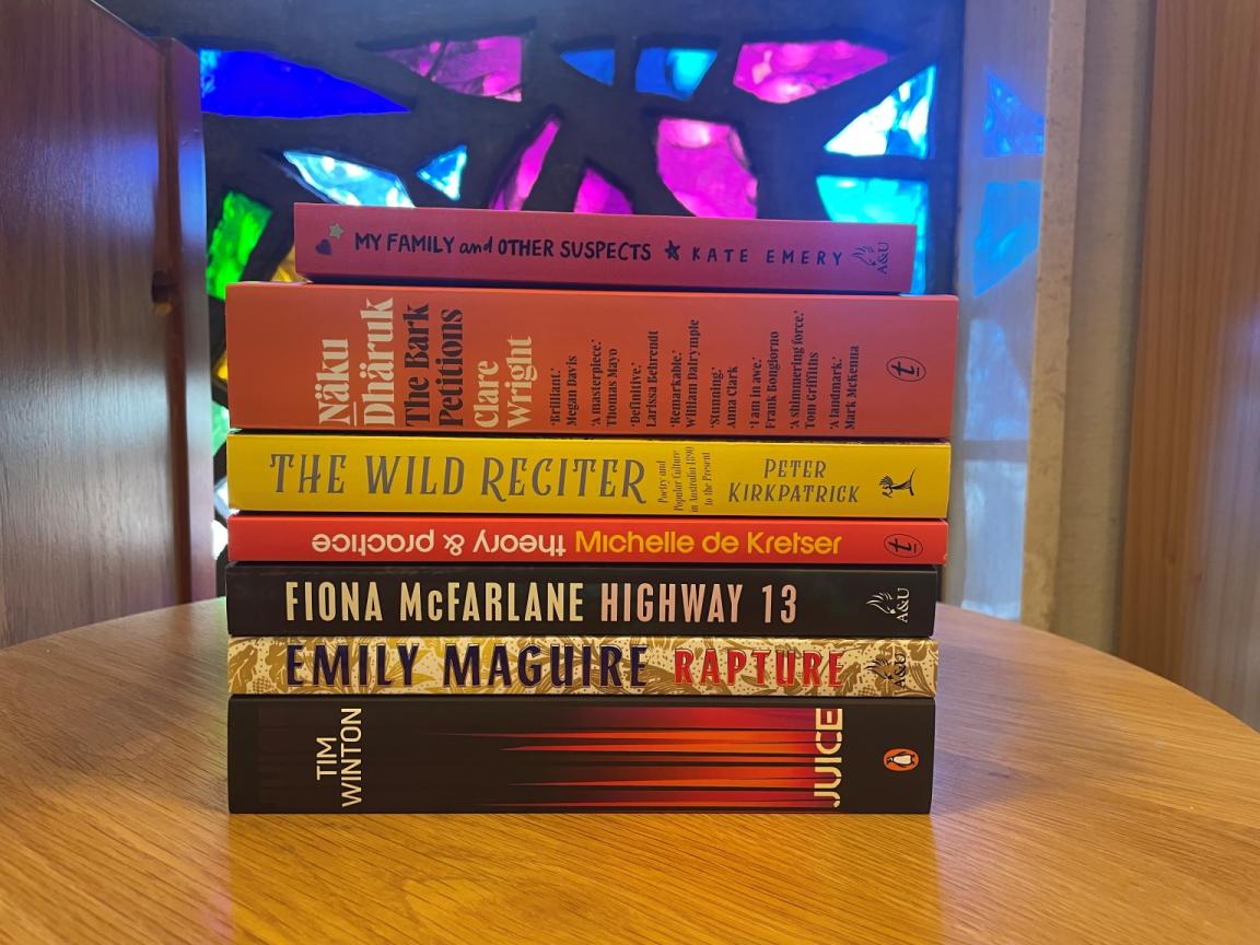 A stack of books showing the spines of selected titles shortlisted for the 2025 Prime Minister's Literary Awards