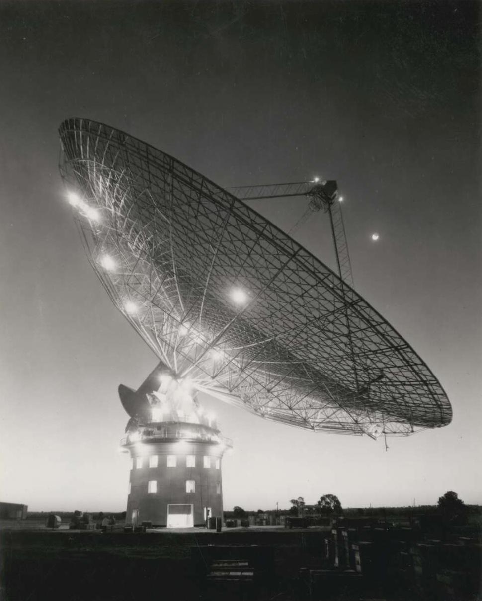  A picture of the side of a radio telescope at night.