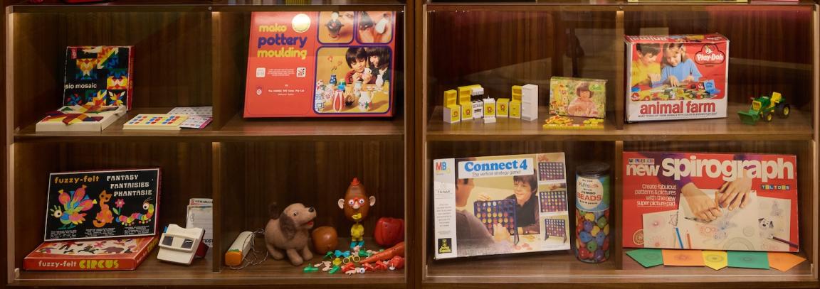 A photograph showing a display of children’s toys and games in the exhibition 1975: Living in the Seventies