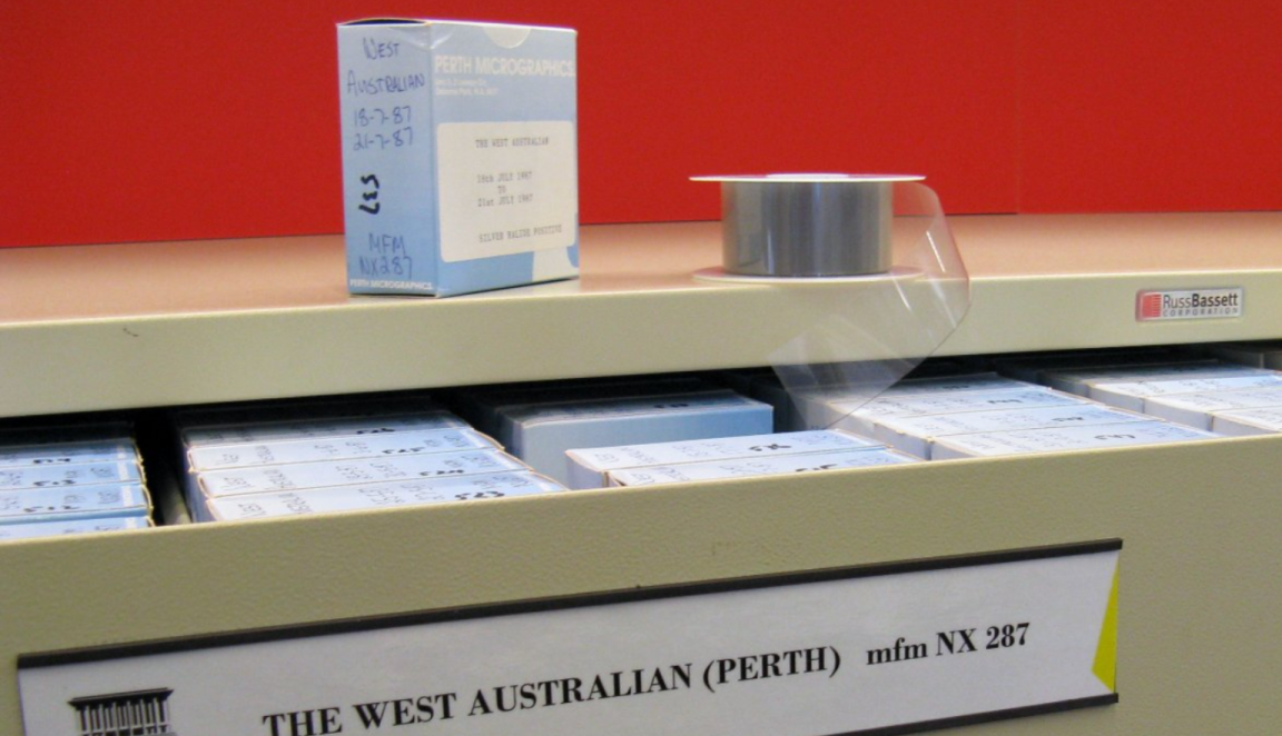 An open drawer filled with microfilm newspapers of 'The West Australian (Perth)'