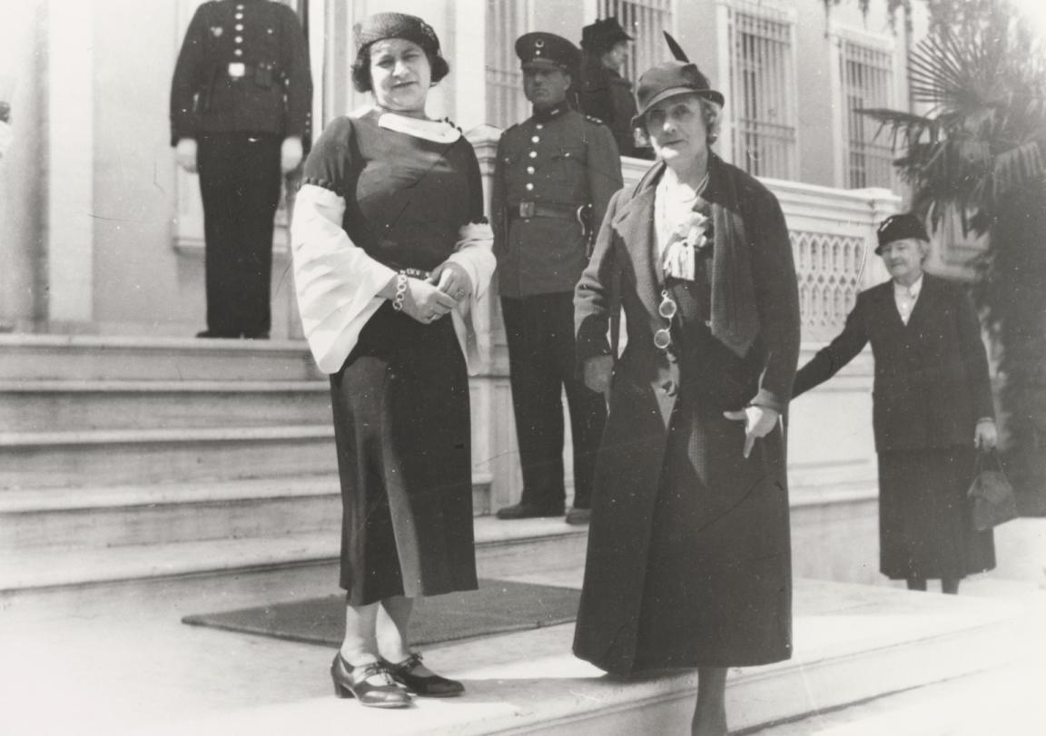 Black and white photo of Bessie Rischbieth and Ruby Rich standing on the steps in front of a building
