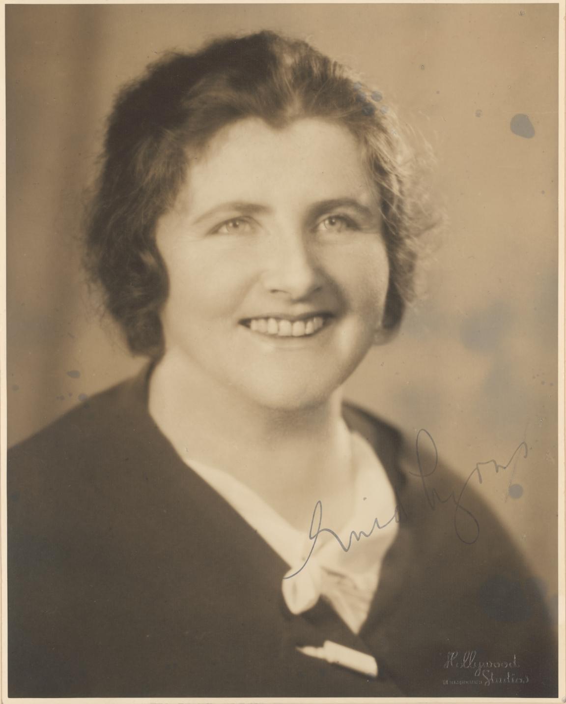 Sepia-toned photographic portrait of Dame Enid Lyons smiling