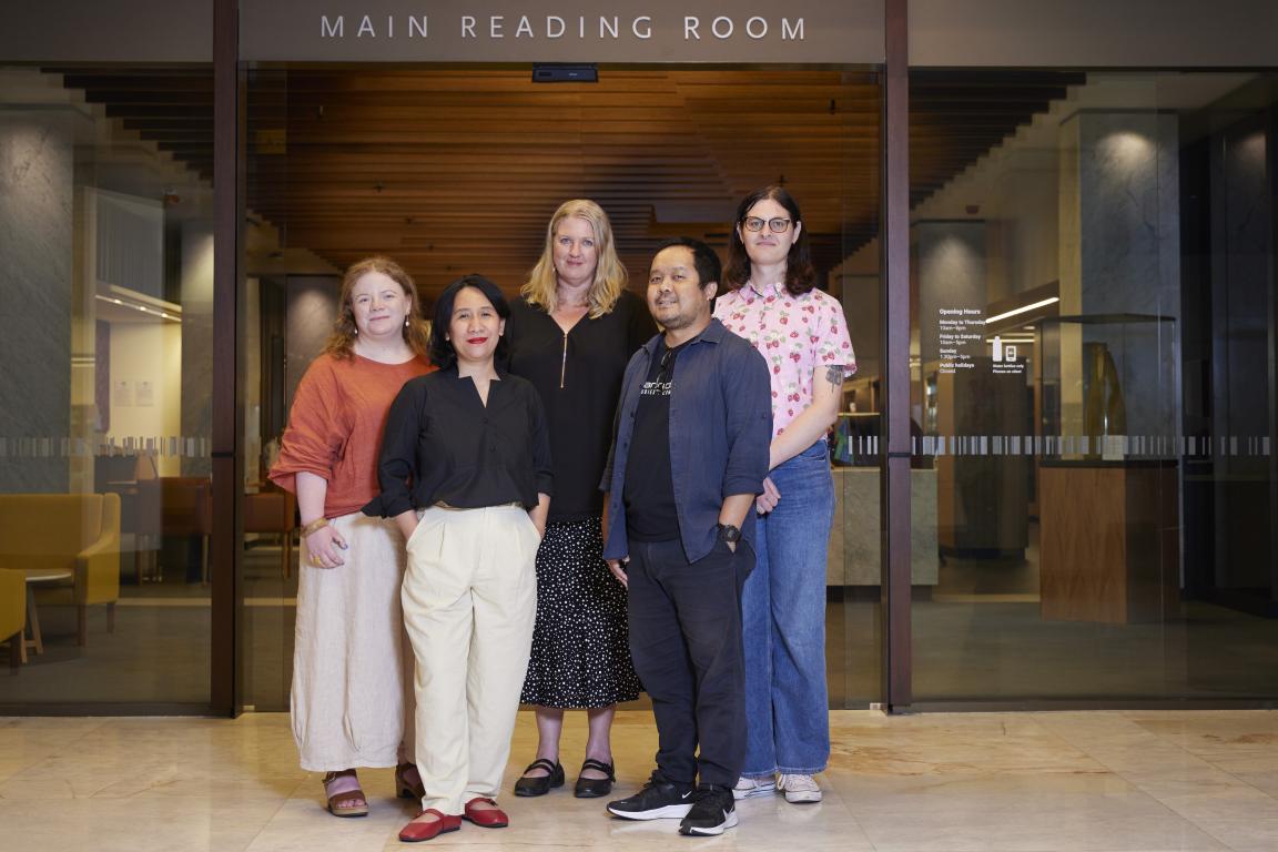 Five people standing in front of the Main Reading Room