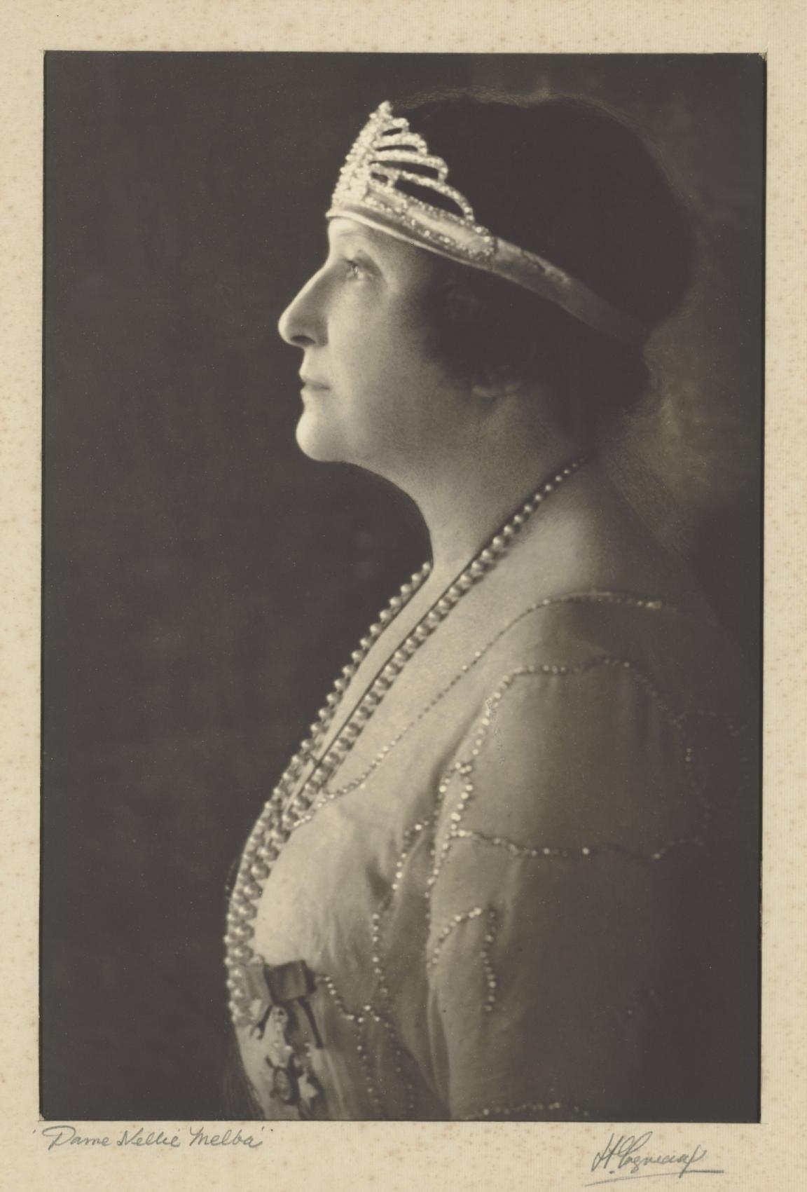 Sepia-toned photo of Dame Nellie Melba in a 1920s style dress and headband