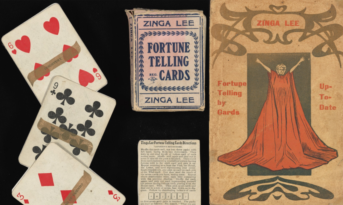 Old playing cards are laid out next to the box depicting a fortune-telling woman, arms stretched out and wearing a red dress