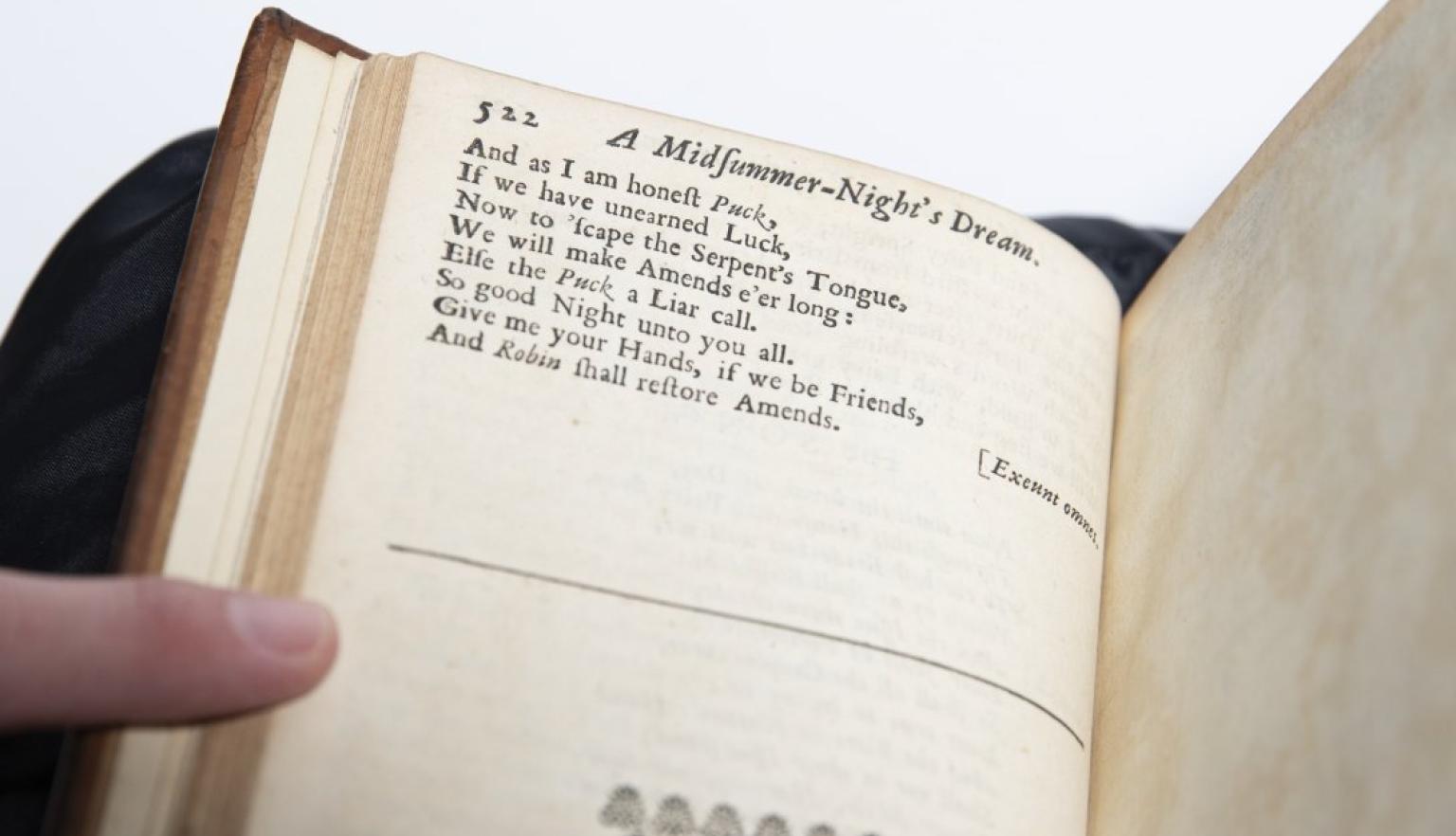 Close up of lines from 'A Midfummer Night's Dream' in an old book