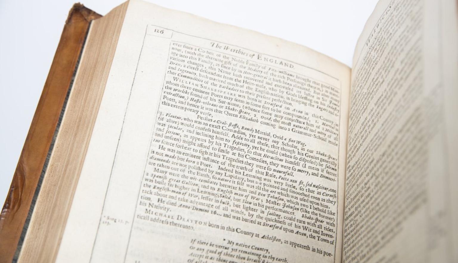 Old book open to page with lots of small text