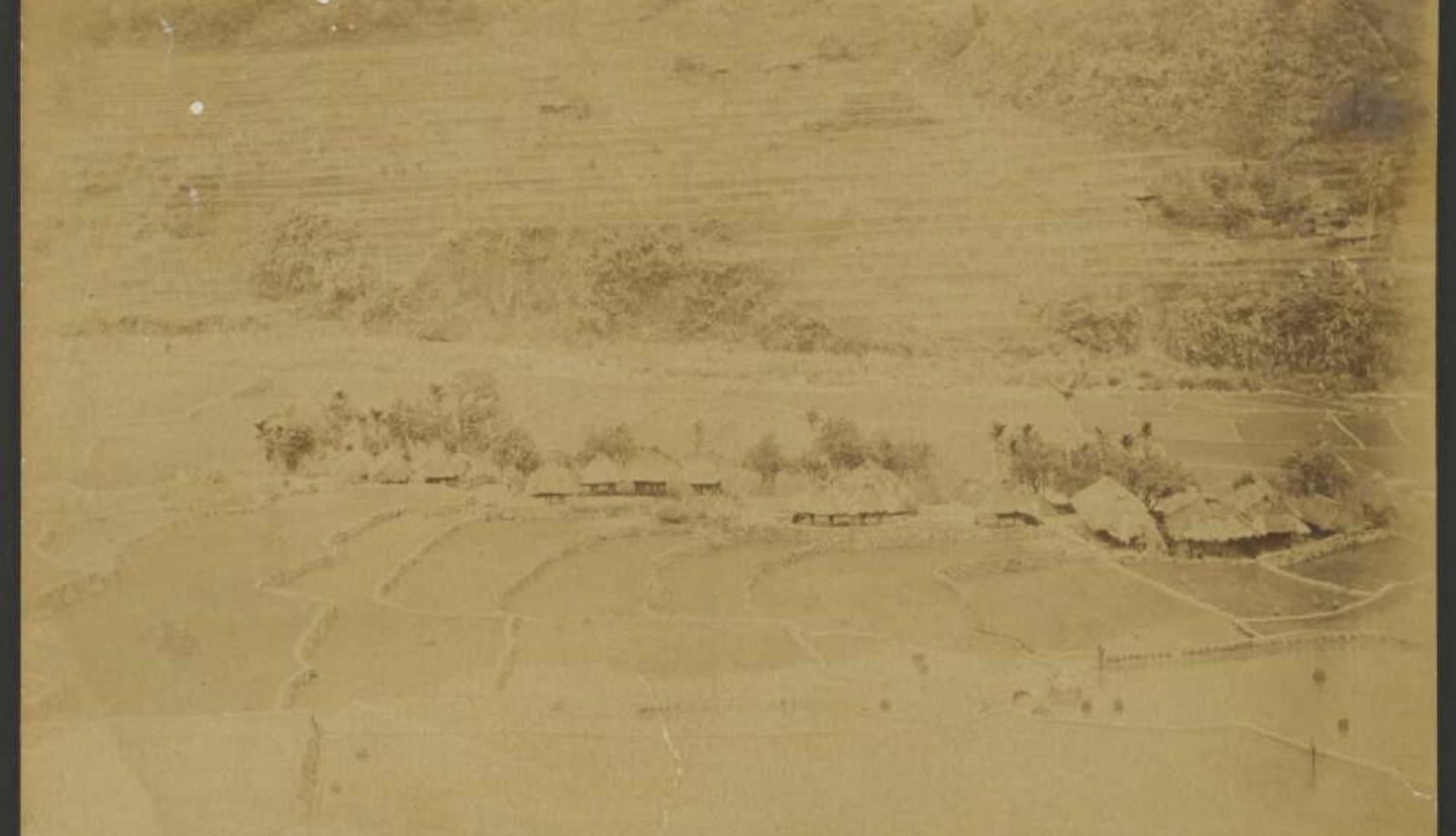 Faded sepia image of rice fields and rice terraces in a small village