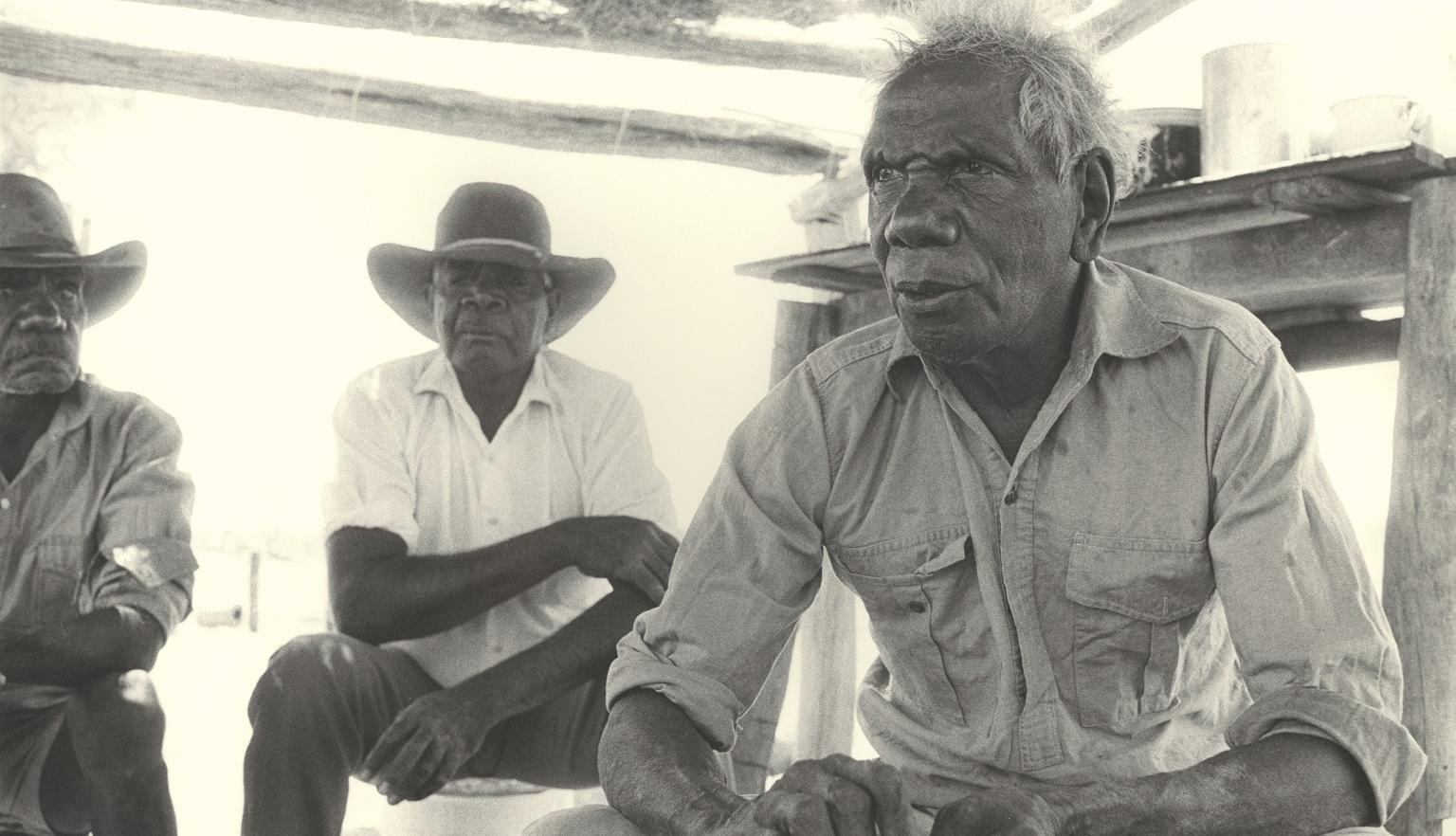 Vincent Lingiari and two other men seated