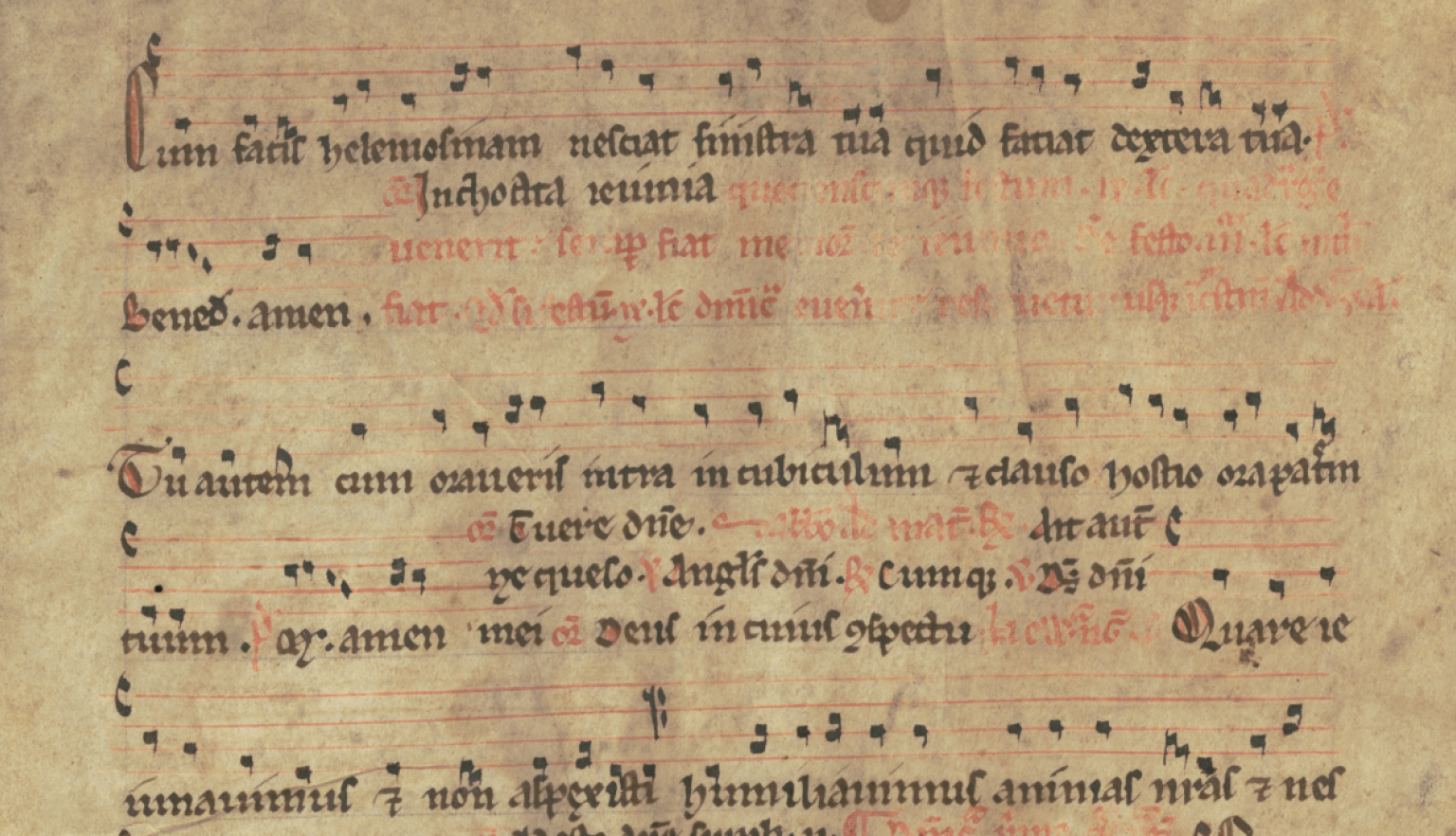 Detail view of a handwritten musical score. The lyrics are in Latin. The musical notation looks similar to modern forms with a treble and bass line clearly visible.