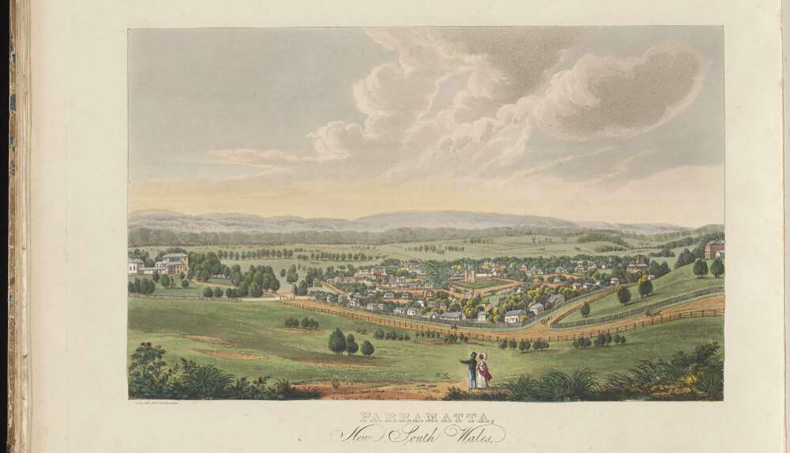 Two people overlooking the rolling hills of paramatta, with the small township in the distance.