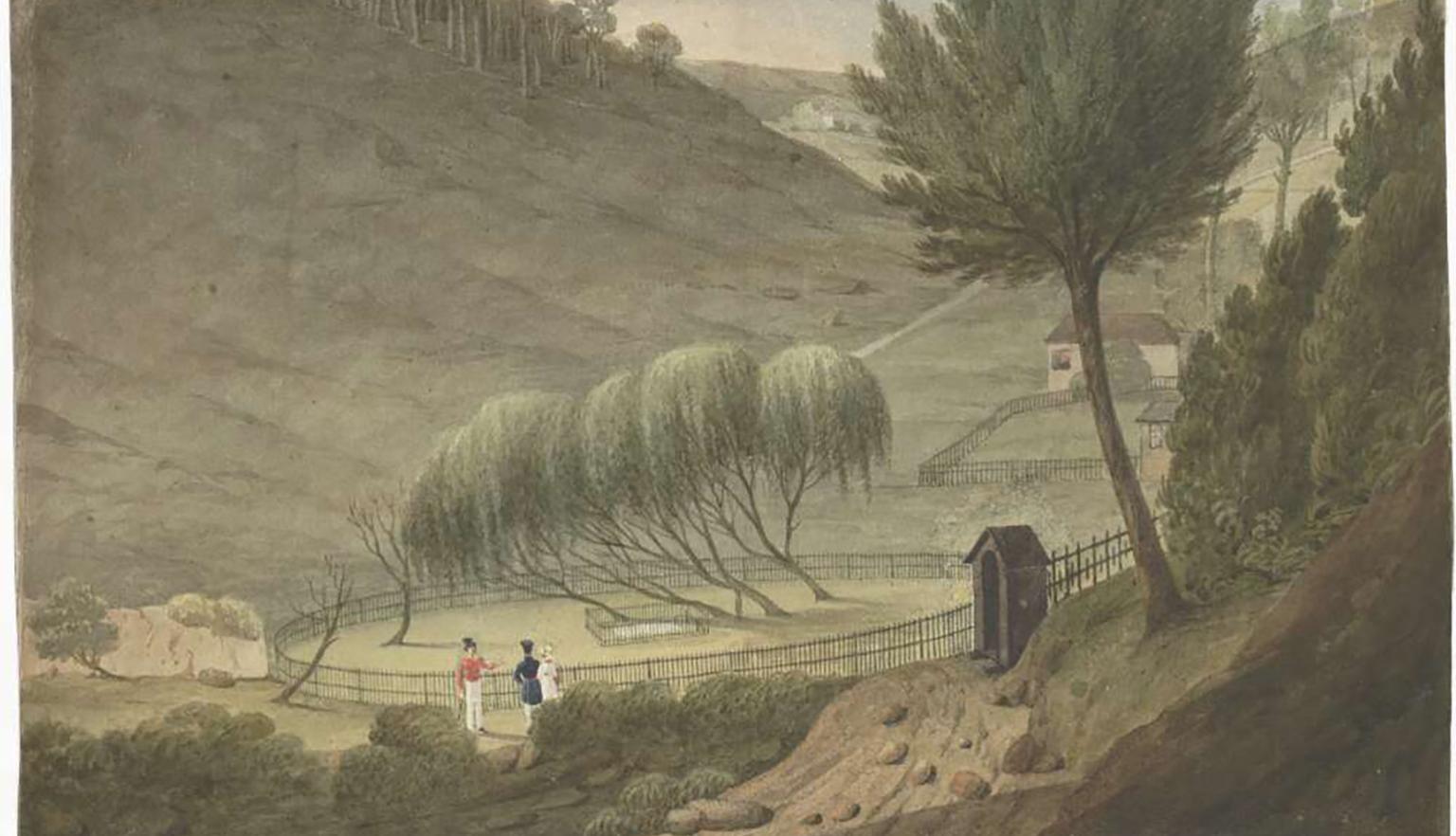 A serene countryside with gently rolling hills. Three individuals walk along the path. A weeping willow tree with drooping branches creates an elegant canopy over a gated off space. Scattered buildings dot the hills in the background.