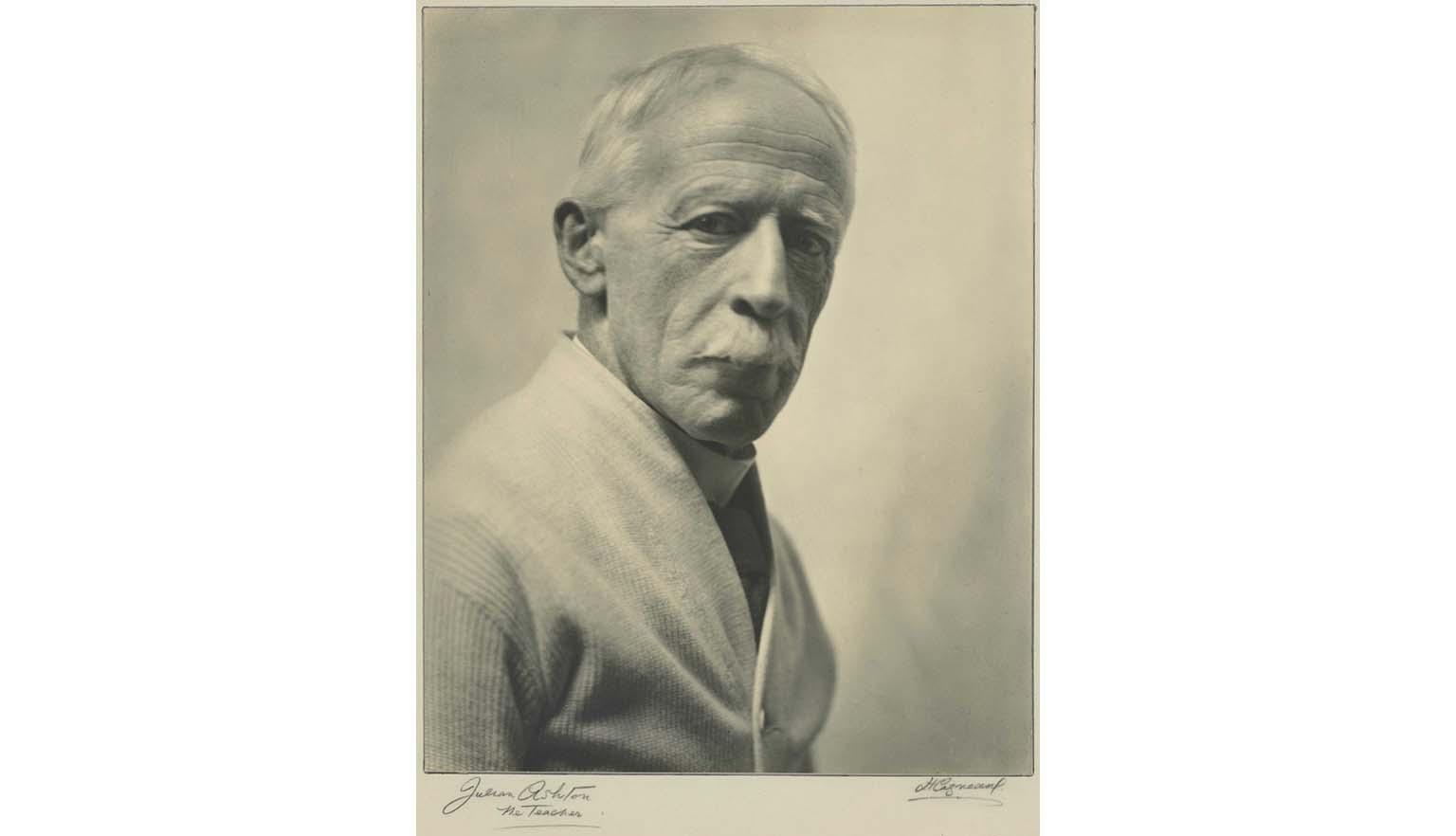 black and white photo portrait of a mustachioed man