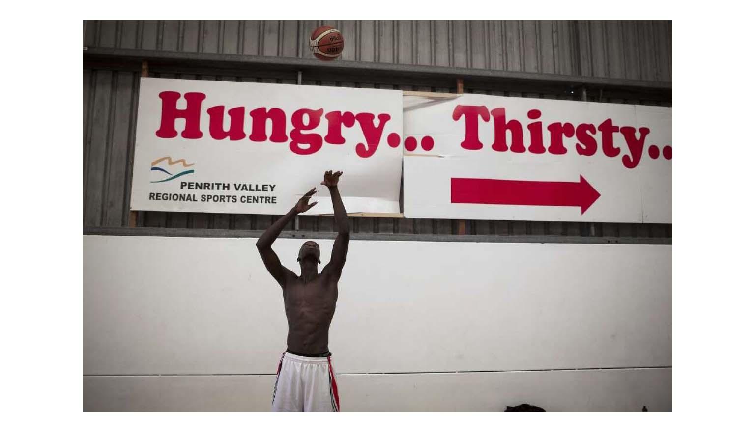 Photo of Laat Gaat throwing a basketball in the air